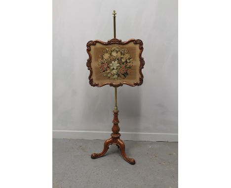 VICTORIAN MAHOGANY POLE SCREEN, the brass column supporting a shell and 's' scroll moulded banner frame with floral tapestry 