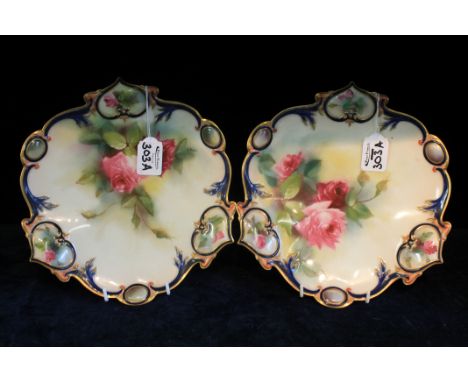 PAIR OF ROYAL WORCESTER CABINET PLATES, hand-painted with roses within blue and gilt scrolling border, signed K.H. Blake, sha