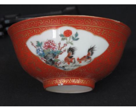 SMALL CHINESE PORCELAIN ORANGE GROUND, OVER GILDED TEA BOWL, decorated with reserved panels of cockerels with foliage and ove