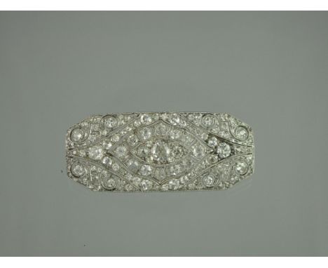 AN ART DECO LACLOCHE FRERES DIAMOND BROOCH of rectangular form with canted corners in openwork geometric form with some scrol