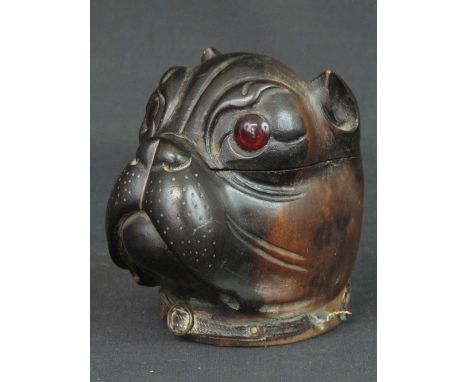 19th CENTURY LIGNUM VITAE CARVED INKWELL in the form of a Boxer dog's head, with glass eyes and leather neck strap, the top r