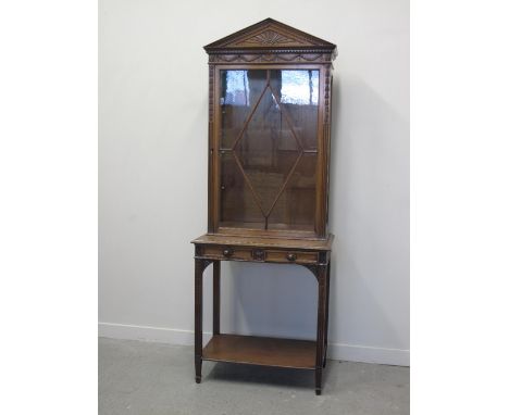 EDWARDIAN MAHOGANY TWO STAGE ARCHITECTURAL DISPLAY CABINET, having triangular pediment above swag and floral moulded detail w