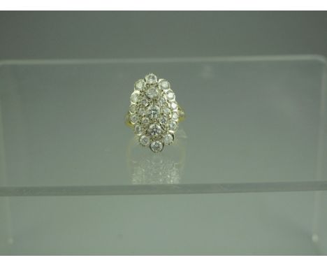 A FRENCH 18ct GOLD AND DIAMOND OVAL CLUSTER RING set with twenty three diamonds, estimated total diamond weight 2 cts.  Ring 