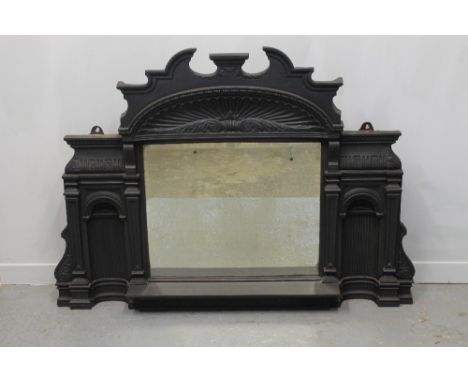 18th CENTURY DESIGN CAST IRON OVER-MANTEL, having broken arch pediment above fluted fan arch with bevelled mirror below, flan