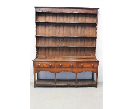 LATE 18th CENTURY WELSH OAK POT BOARD DRESSER, the later boarded rack having moulded cornice over reeded edge shelves and wit