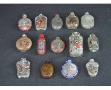 COLLECTION OF CHINESE GLASS OR ROCK CRYSTAL REVERSE PAINTED SNUFF BOTTLES of various shapes and sizes, featuring portrait stu