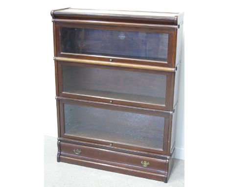 MAHOGANY THREE-TIER GLOBE WERNICKE GLAZED BOOKCASE, having up-over doors and single drawer to the base.  34" x 10" x 45.5" (8