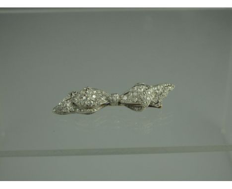 A VICTORIAN DIAMOND ENCRUSTED BOW BROOCH.  Width 49mm x 12mm.  Weight 5.4g. CONDITION REPORT: In good condition, no obvious d