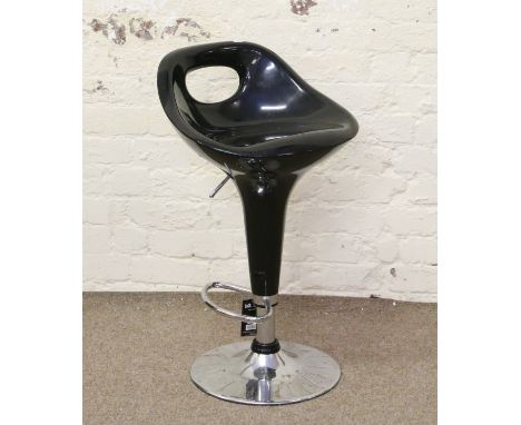 A chrome based bar stool.