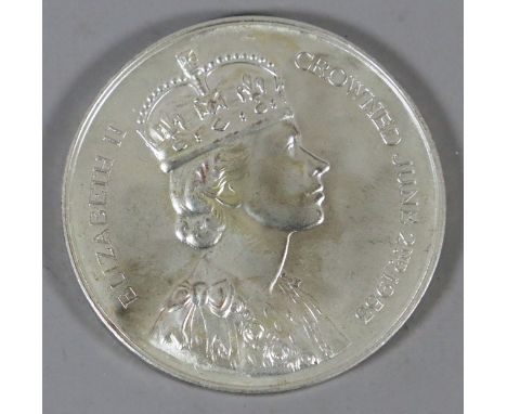 A silvered bronze commemorative medal by Spink of London. Portrait of Elizabeth II 'Crowned June 2nd 15953' and a topographic