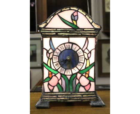 A Tiffany style illuminating clock with quartz movement.