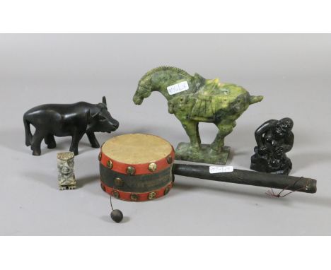 An Oriental hand drum and four carvings including a jade effect stone Tang style horse.