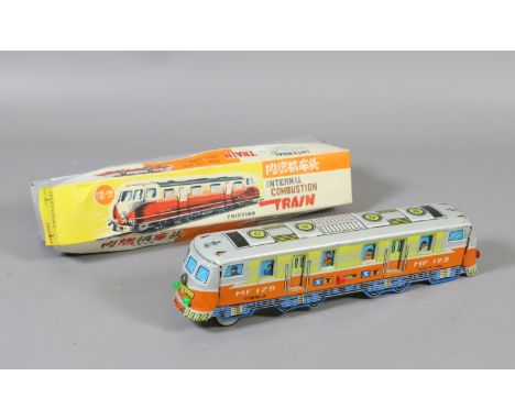 A vintage Chinese boxed tinplate internal combustion train.