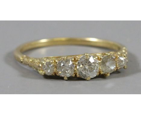 A Victorian 18 carat gold ring set with five old European cut diamonds approximately 1.0ct total weight. Ring size R.