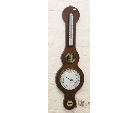 An Edwardian oak banjo barometer with enamel dial.