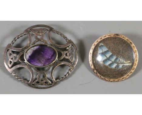 A Celtic style silver brooch inset with a Blue John oval together with a pinchbeck brooch possibly enamel.