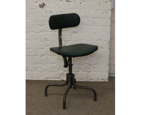 A vintage metal based office swivel chair.