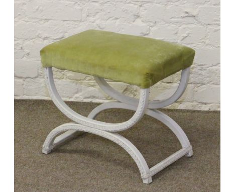 A painted X-frame stool.