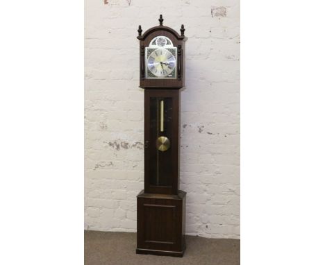 A modern mahogany cased granddaughter clock complete with three weights and pendulum.
