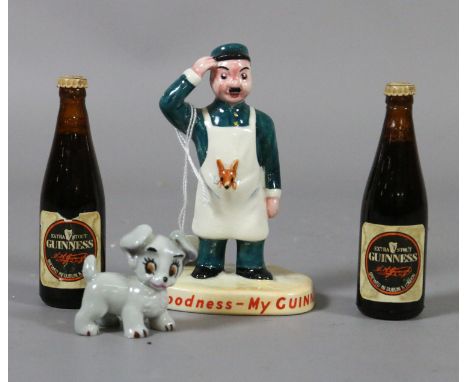 A Carltonware advertising Guinness figure, two miniature bottles of Guinness and a Wade 'Lady and the Tramp' whimsy.