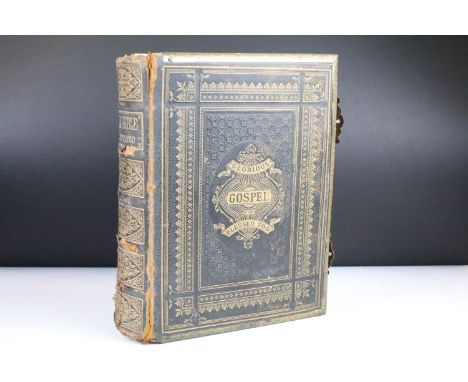An antique Brown's Family Bible with numerous colour illustrations and a family portrait gallery of CDV photographs. 