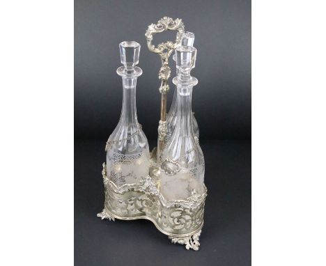 19th Century silver plated three-bottle decanter stand with pierced scrolling &amp; floral detail, complete with three tall g