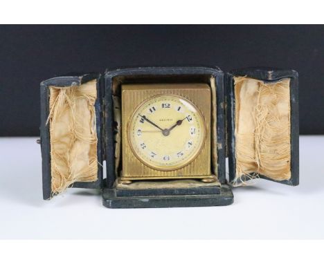 An early 20th century swiss made Zenith travel clock complete with travel case.