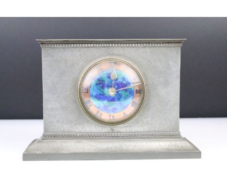 Liberty &amp; Co. pewter mantel clock, the rectangular beaten case with a circular blue enamel &amp; copper dial with Roman n