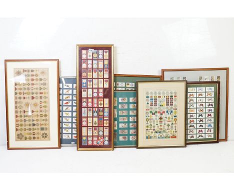 A collection of seven framed and glazed set of cigarette cards together with two framed and glazed medal posters. 