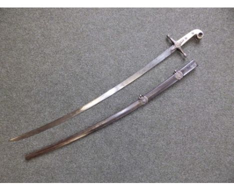 A Victorian officer's mameluke sword in scabbard, with ivorine hilt, the 32.5" blade with engraved decoration.