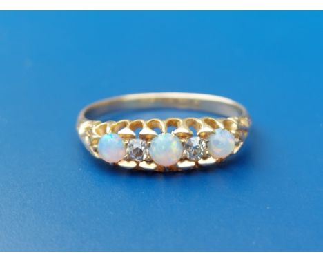 A small late Victorian/Edwardian five stone opal &amp; diamond set 18ct gold ring.  Finger size N/O - one opal chipped.