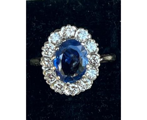 A certified natural 2.68 carat Sri-Lankan sapphire &amp; diamond oval cluster ring, on 18ct gold shank, accompanied by a Gem 