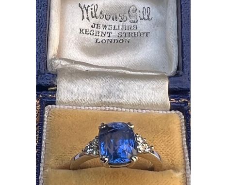 A certified natural 5.04 carat Sri-Lankan sapphire &amp; diamond ring, the four-claw set rectangular cushion cut sapphire wit