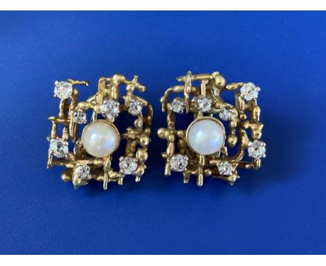A pair of 1970's certified natural saltwater pearl &amp; diamond set clip-on earrings in yellow metal, of open geometric matr