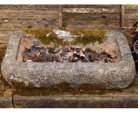 A rectangular stone bird trough, 24" x 13". SEPARATE VIEWING ARRANGEMENTS EXCLUDING SATURDAY.