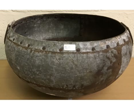 A rustic metal ornamental cooking pot with twin handles, 37 cm diameter x 19.5 cm high 