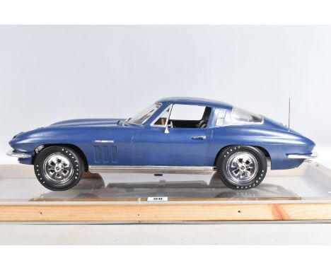 A 1/8 SCALE MODEL OF A 1965 CHEVROLET CORVETTE STINGRAY, has been constructed and finished to a good standard from the Revell
