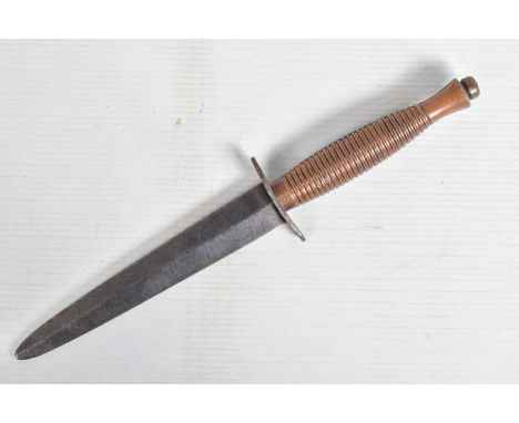 A FAIRBAIRN SYKES COMMANDO KNIFE, this has an un-marked blade and a wire bound handle but is missing its scabbard, there is s