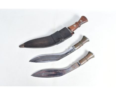 THREE KUKRI STYLE KNIVES, the three Kukris all have blades that are not marked, one comes in its original scabbard and the tw