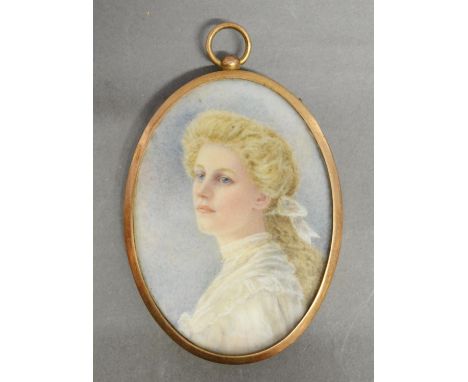 An Edwardian Oval Miniature Portrait in the form of a Girl wearing a White Blouse, 7.5 x 5.5 cms 