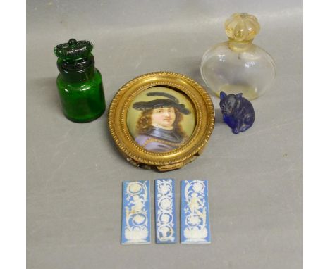 A Continental Porcelain Oval Plaque, Head and Shoulder Portrait of a Classical Figure, together with three small bisque recta