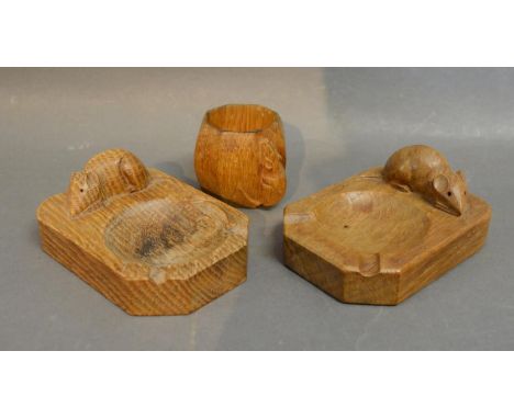 A Robert (Mouseman) Thompson Carved Oak Ashtray surmounted with a model of a mouse, together with another similar and a simil