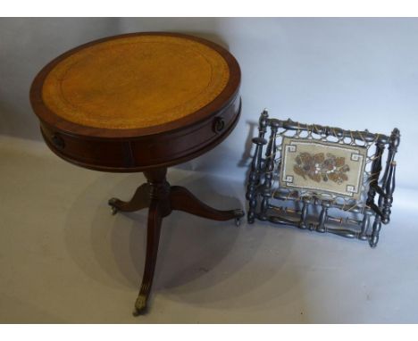 A Mahogany Drum Table, the leather top above an arrangement of drawers with turned centre column and reeded tripod supports, 