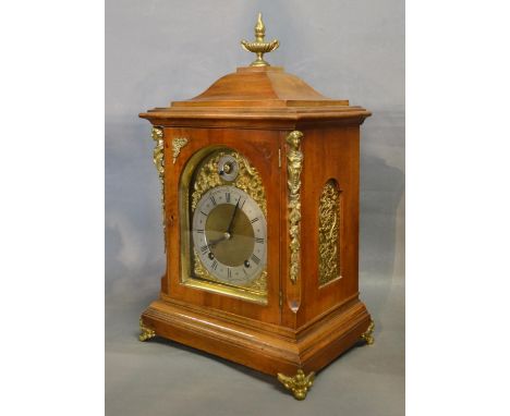 An Early 20th Century Mantle Clock, the gilt metal mounted case with brass finial, the brass dial with silvered chapter ring 