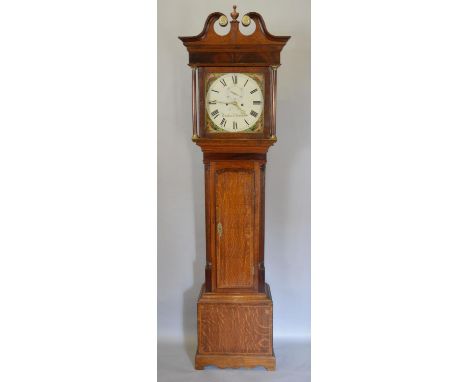 A George III Oak Long Case Clock, the swan neck pediment above a square hood with turned pilasters and a shaped door, raised 