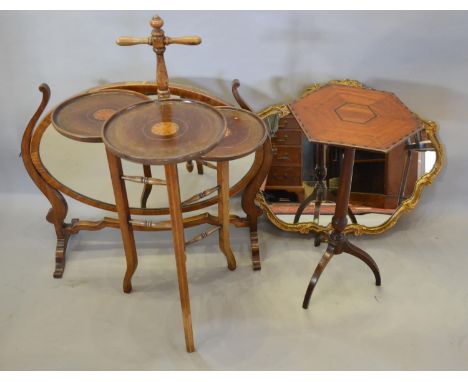 A 19th Century Mahogany and Walnut Occasional Table, the octagonal inlaid top above a turned tapering column and three outswe