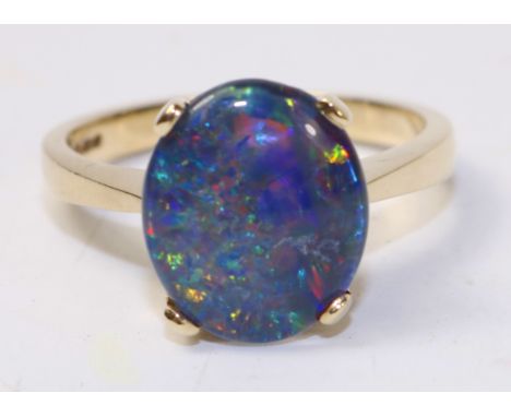 Blue opal gold ring hallmarked 9ct   Condition Report   Click here for further images, condition, auction times & delivery co