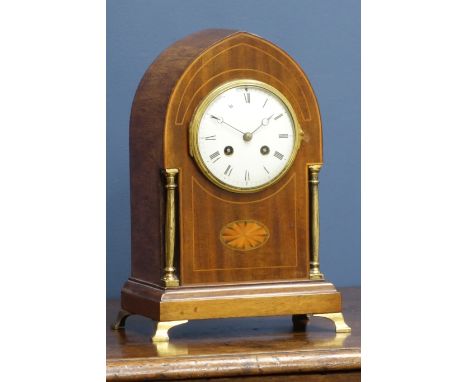Edwardian inlaid mahogany lancet shaped mantel clock, white dial with brass columns and feet, twin train movement striking th
