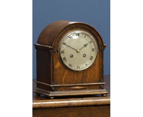 Early 20th century small oak cased clock, chiming the hours and halves on coil, by 'Penlington & Batty, Liverpool', and an Ed