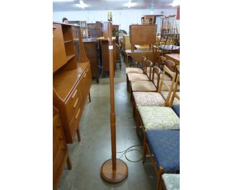 A teak standard lamp 